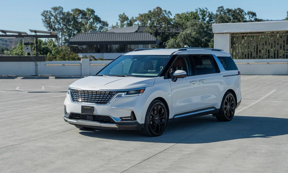 Kia Carnival, white, orange interior, for rent in the San Francisco Bay Area
